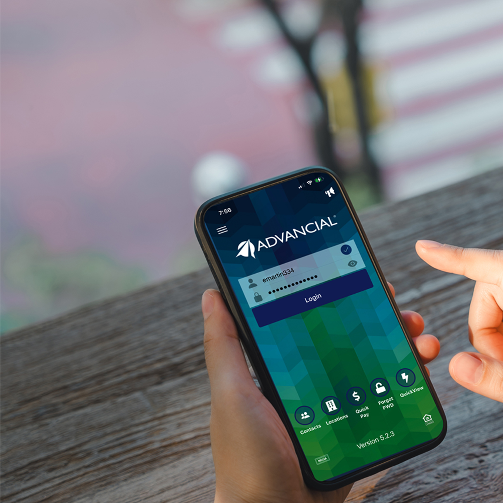 smiling woman on her laptop at a coffe shop