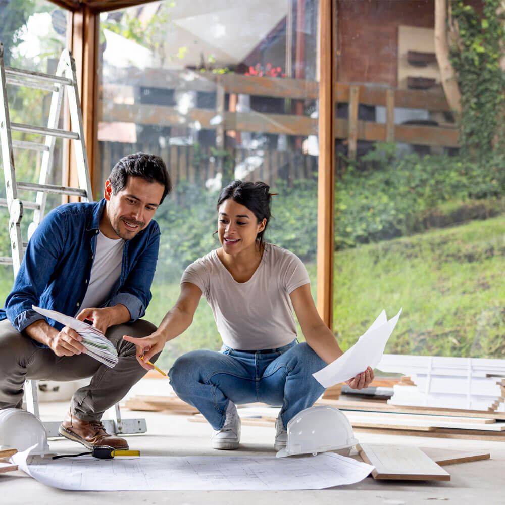 diverse couple building a backyard deck
