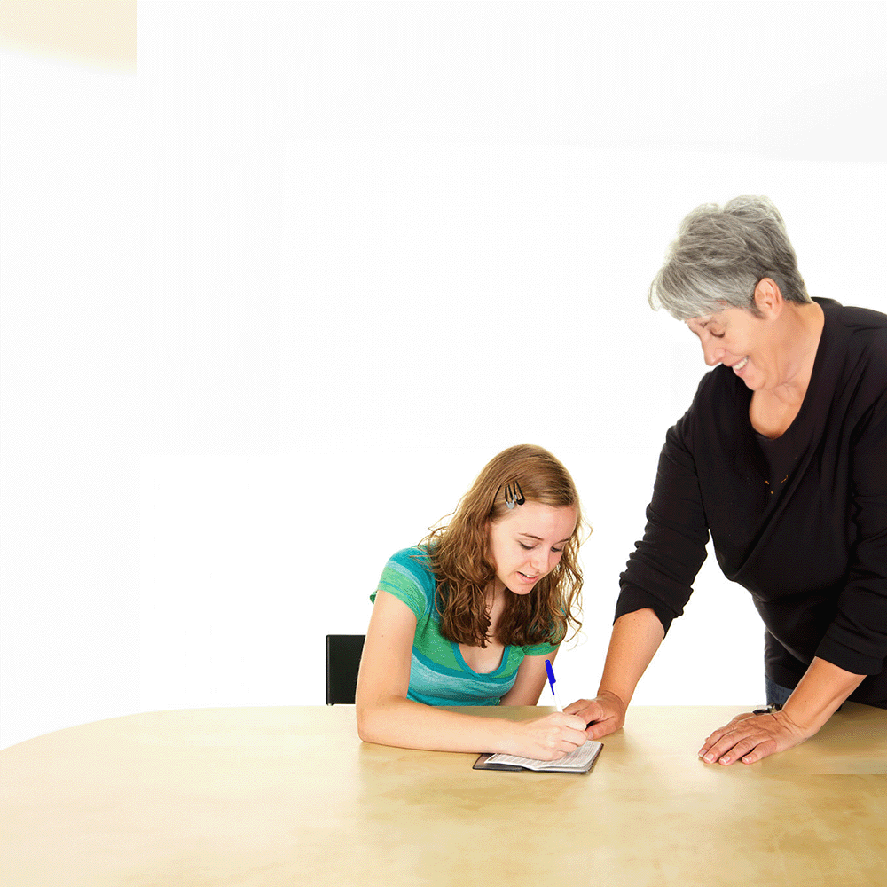 teenage girl learning how to write a check