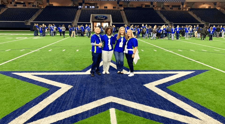 Employees on the Cowboys practice field at Celebrate Advancial