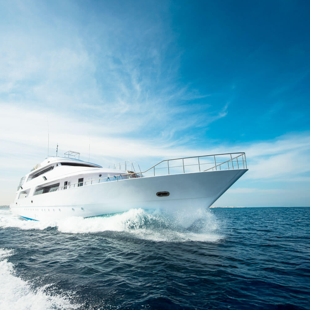 bird's eye view of a boat cruising through blue water