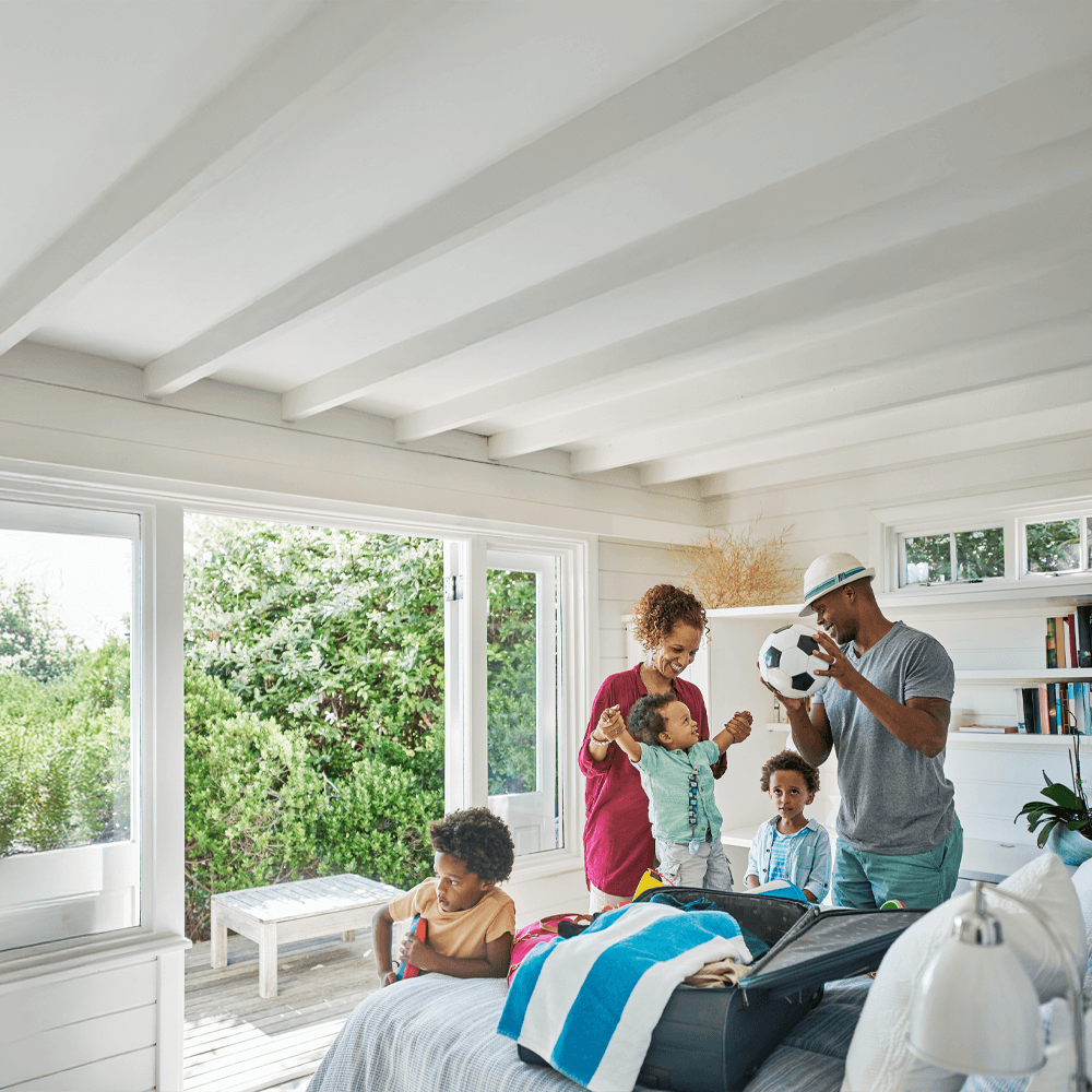 happy couple and three kids on a family vacation