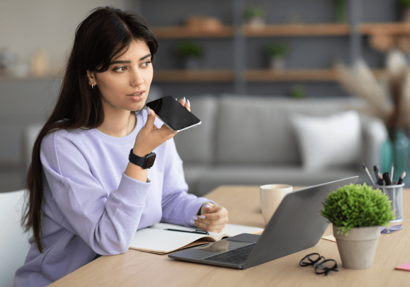 Woman on the phone and on her laptop